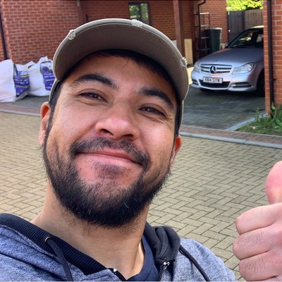Chris Charters, founder of Served Online, giving a thumbs up on a job site in Milton Keynes